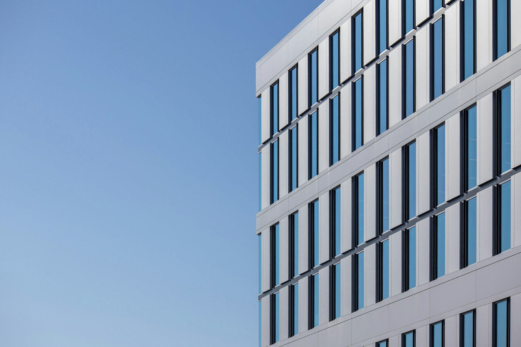 Modern commercial building under blue sky